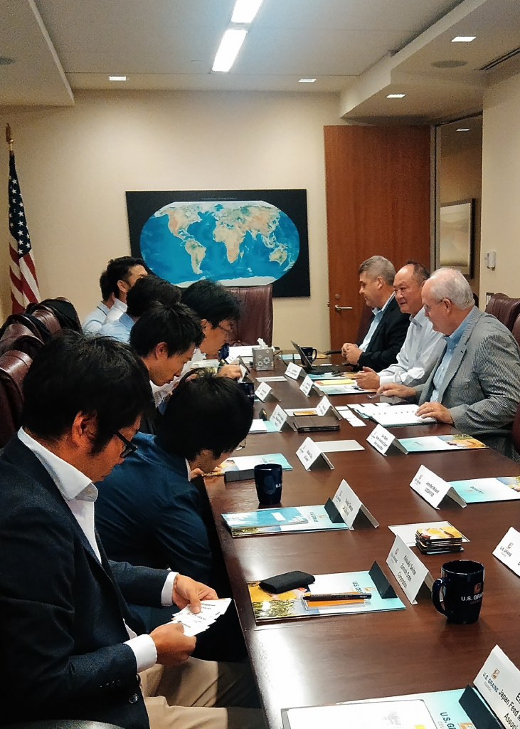 photo of several men at a table in a meeting room