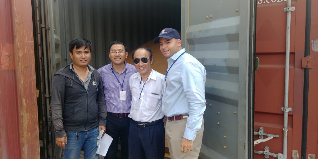 group in front of DDGS container