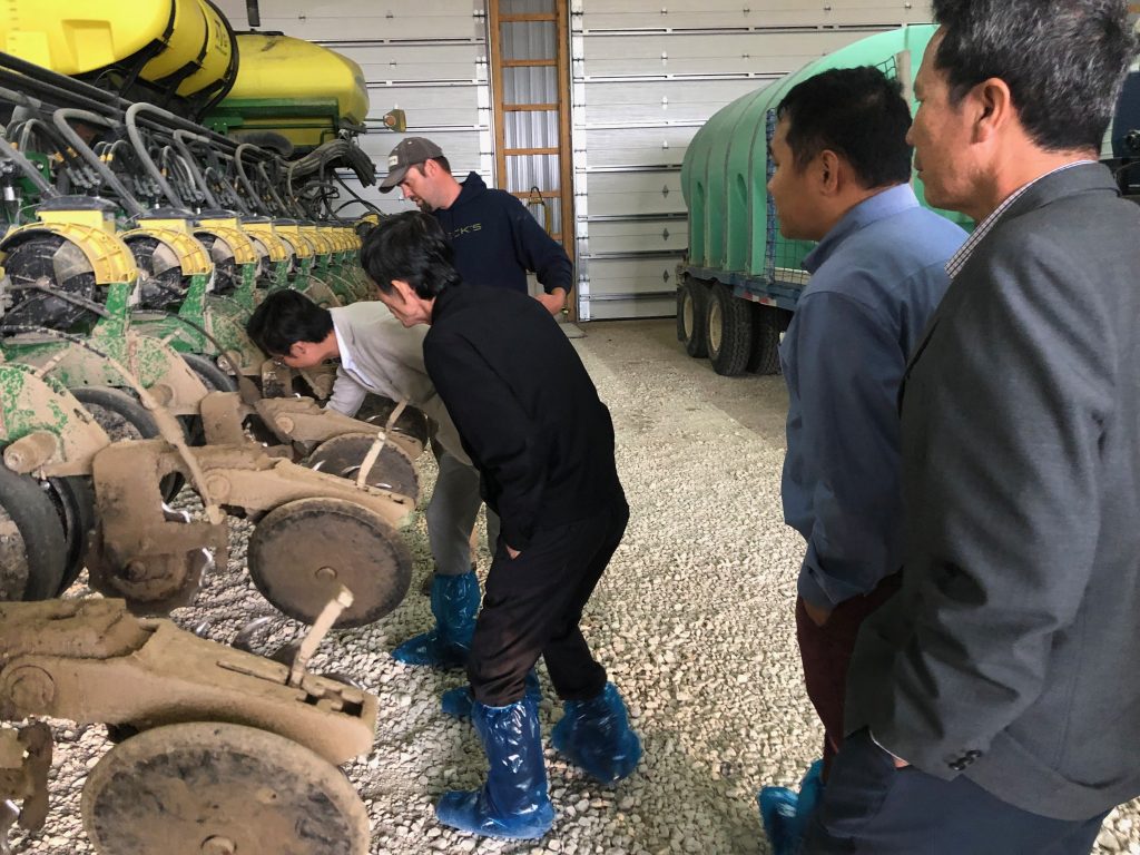 2019 Vietnam Ethanol Team- team examining farm equipment