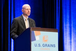 Darren Armstrong standing at podium speaking