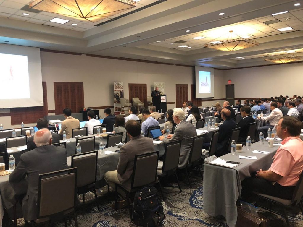 Export Sorghum- audience listening to a man standing behind a podium on stage speaking