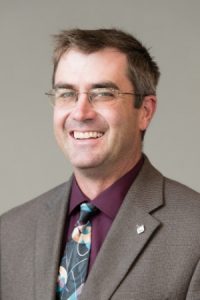 Headshot of Troy Schneider