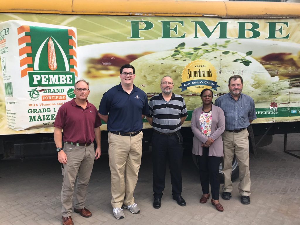 East Africa Trade Servicing- 5 attendees standing in front of a delivery truck