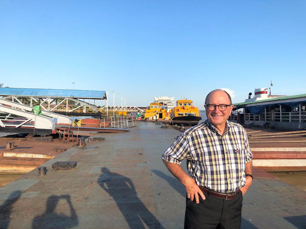 Former USGC Board Member, Wayne Humphreys standing at a port in front of a ship at the loading dockUSDA ATM