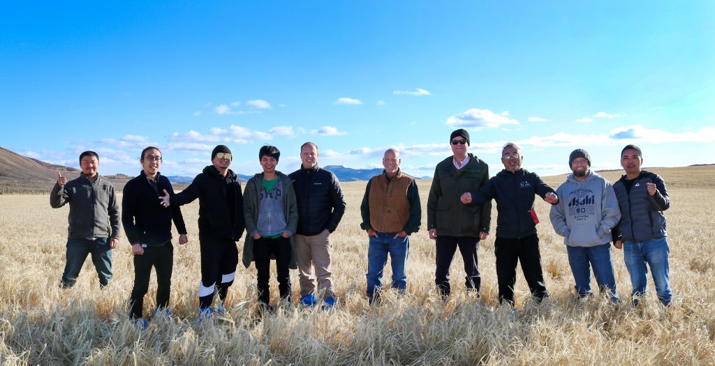 Chinese Malt Barley Team to Idaho- team members standing in a field of barley