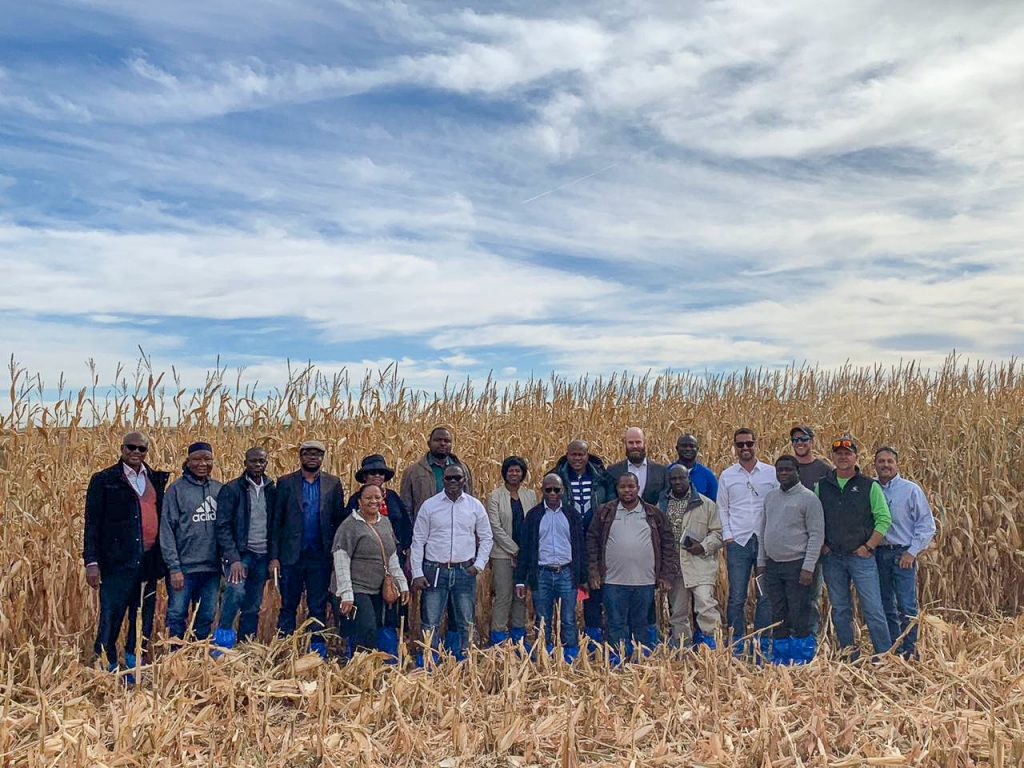 Global Ethanol Summit - Post-Tour, group photo of team members standing in a corn field