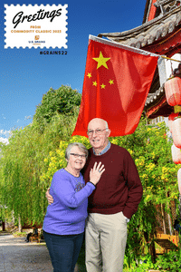 Image of two people standing in front of a backdrop of China