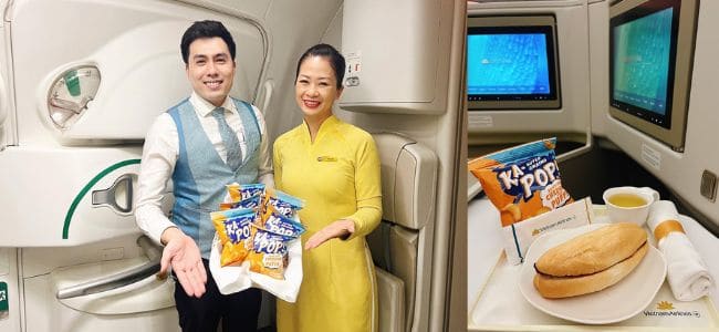 image of two flight attendants in Vietnam holding snack foods