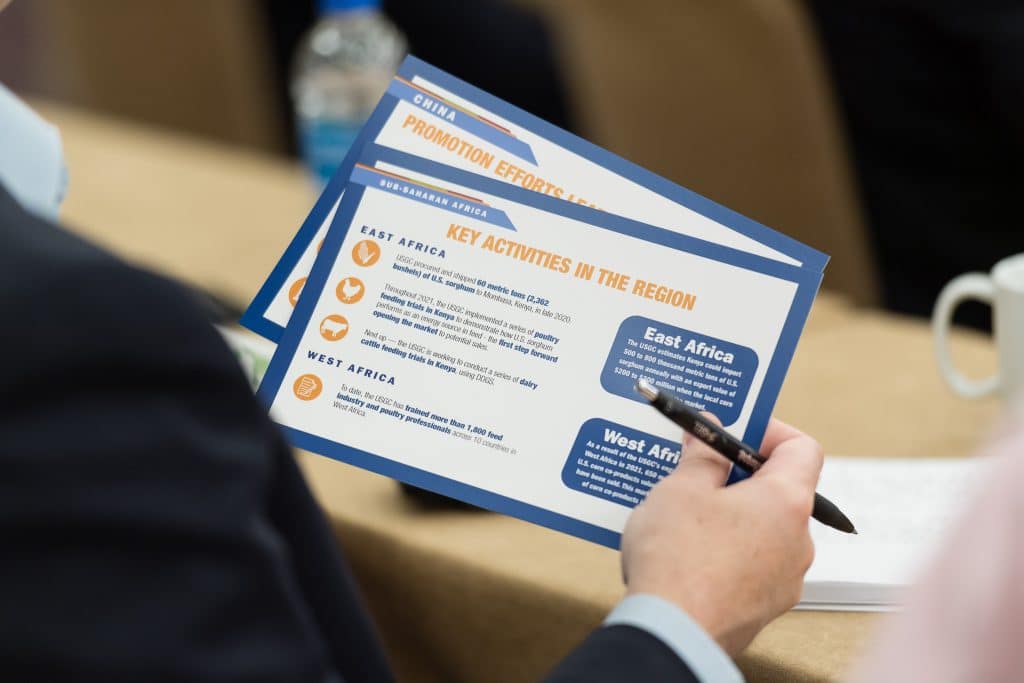 image of person holding infographic cards