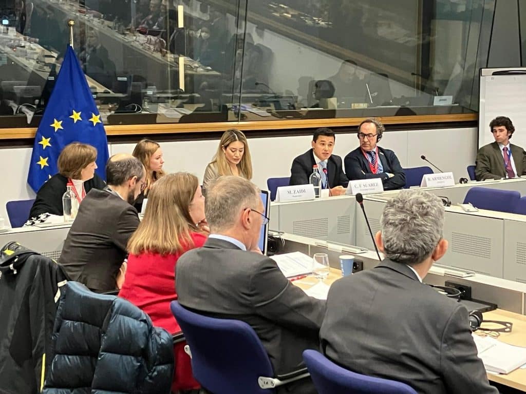 image of a man speaking at a round table in Brussels