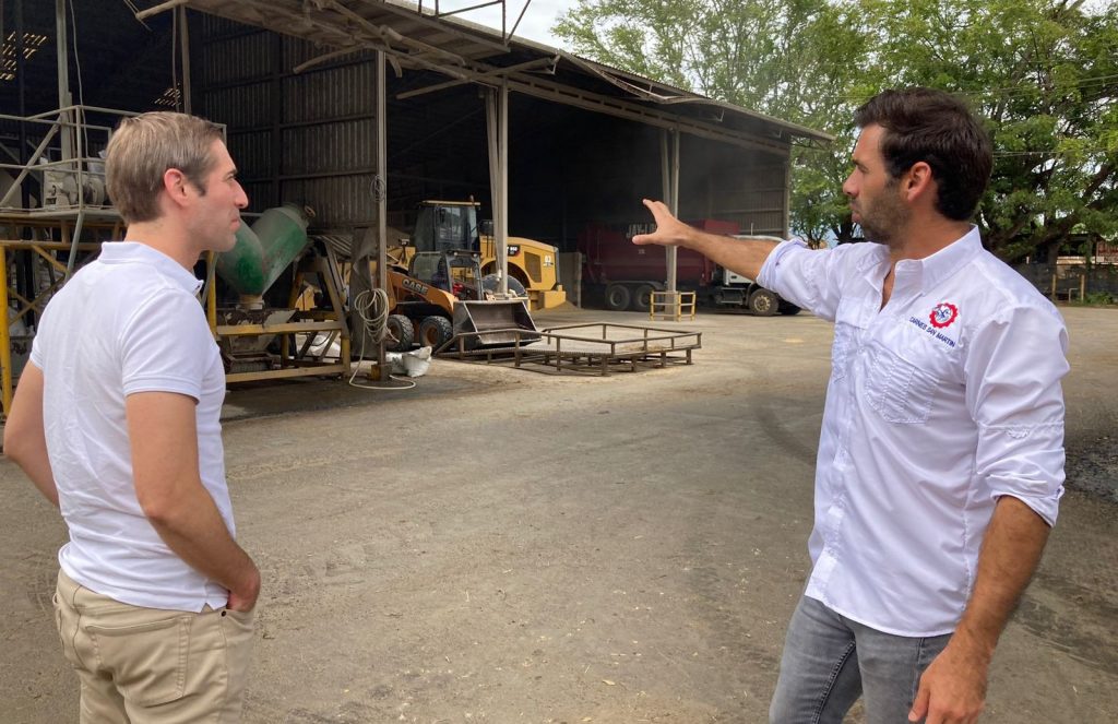 image of two men talking at a feedlot