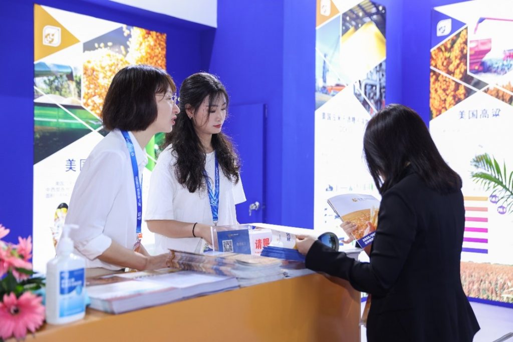 image of women talking in a trade show booth
