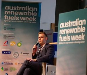image of a man speaking on a panel