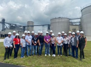 image of a group of people wearing hard hats at an ethanol plant