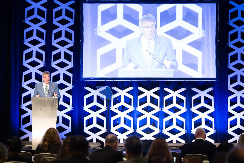 image of man speaking to an audience