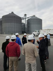 A group of people in hard hats at an ethanol plant