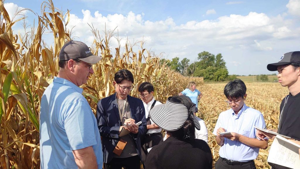 A group of men in a corn field