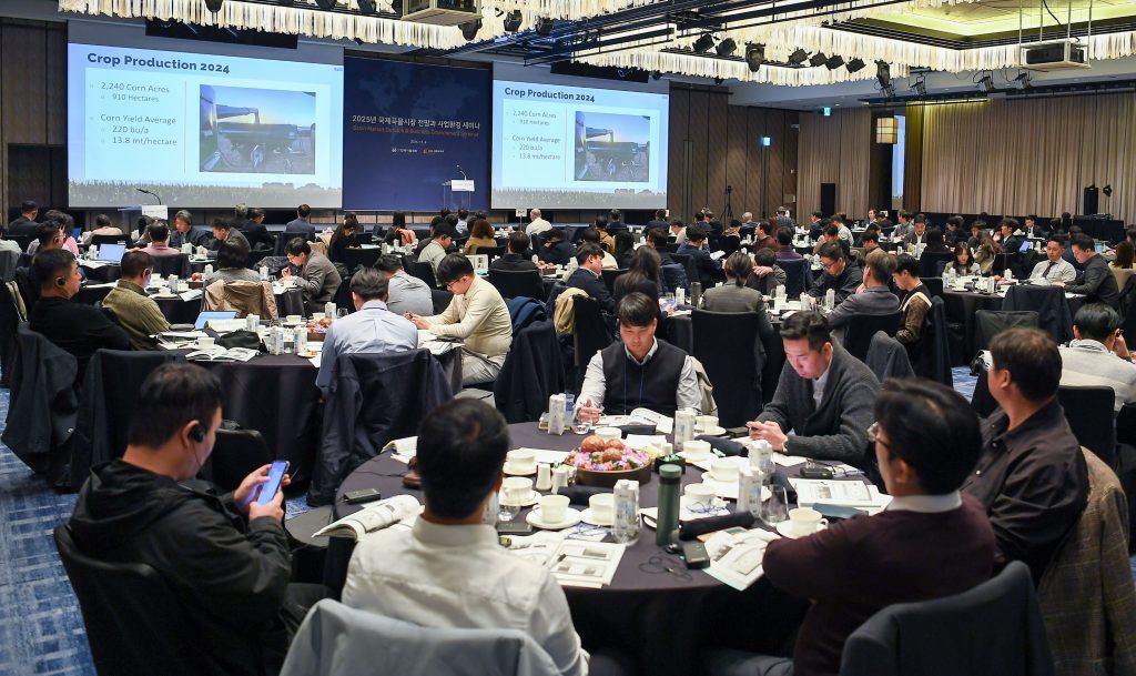 A large conference room with attendees