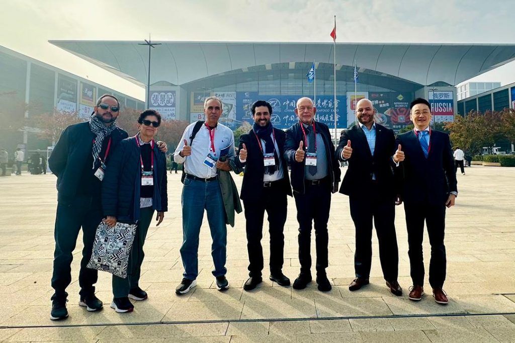 A group of people in front of a convention center