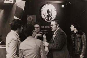 A group of people standing and talking