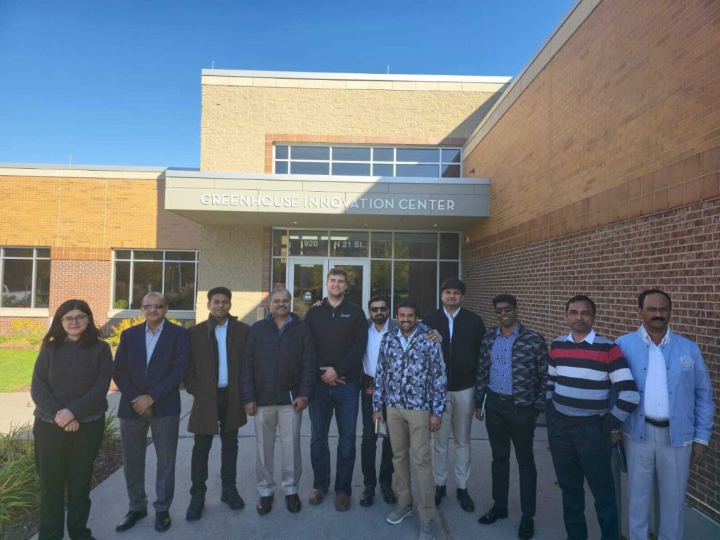 A group of people in front of a university building